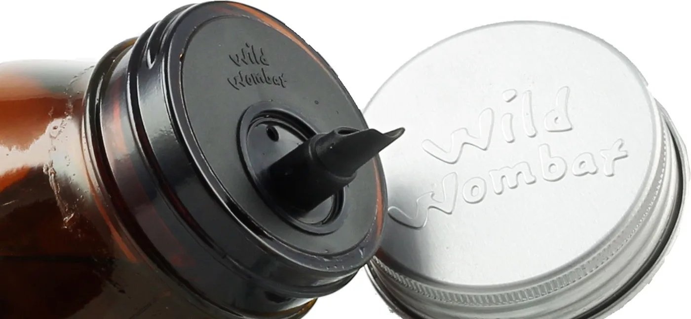 The aluminium cap next to the black spring pourer on the bottle neck