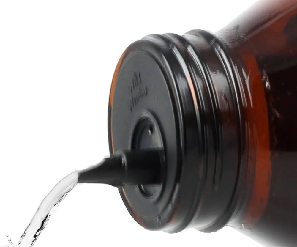 Spirit pouring in a clean stream from the black pourer